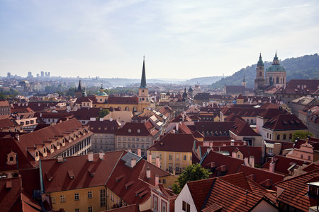 PRAGUE, CZECH REPUBLIC - OCTOBER 3, 2021: View of Mala Strana roofs and St. Nicholas Church in...