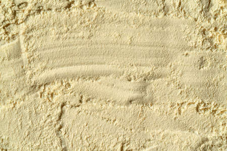 Background made of whey protein powder, with copy space - healthy nutritional supplement