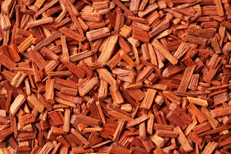 Background made of red sandalwood - ingredient for perfumes and aromatherapy