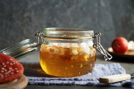 Preparation of herbal tincture from red fly agaric or amanita in a jar - alternative remedy for the jointsの写真素材