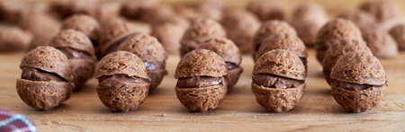 Panoramic banner with homemade Christmas cookies in the form of nuts filled with cocoa creamの写真素材