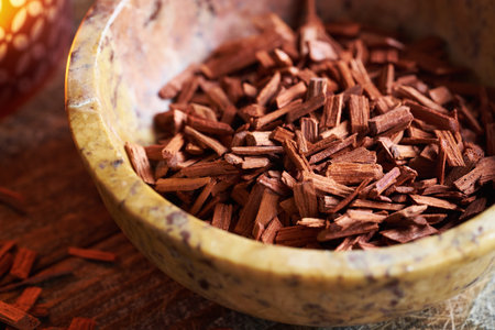 Red sandalwood chips in a bowl - ingredient for essential oils