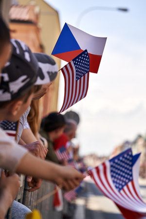 Czech and American flags in peoples' hands in the street - celebration of liberation of  Plzen by USAの写真素材