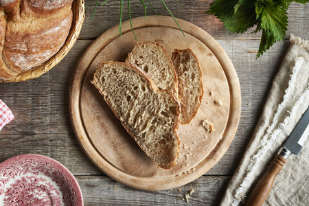 Slices of sourdough bread on a rustic table, top view