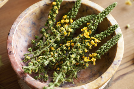 Dried agrimony flowers in a bowl, close upの写真素材