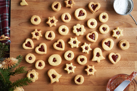 Homemade Linzer Christmas cookies filled with red strawberry marmalade, top view