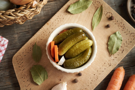 Homemade gherkins or cucumber pickles in a white bowl, top viewの写真素材