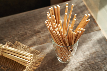Ecological paper and bamboo drinking straws on a tableの写真素材