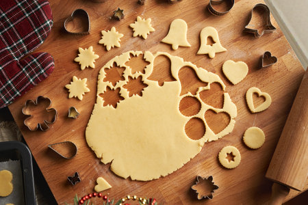 Shapes cut out from rolled out pastry dough to prepare homemade Linzer Christmas cookies, top viewの写真素材