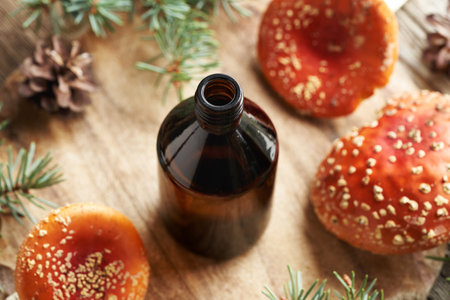 A brown bottle of herbal tincture made of red fly agaric or amanita mushroom - alternative ointment for the jointsの写真素材
