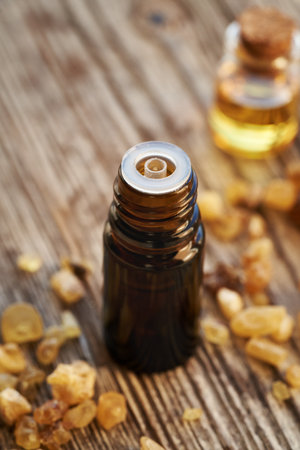 A brown bottle of frankincense essential oil with boswellia resinの写真素材