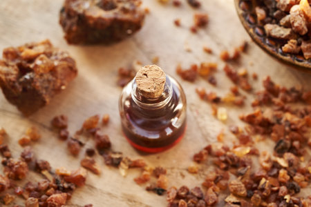 Myrrh essential oil and resin on a tableの写真素材