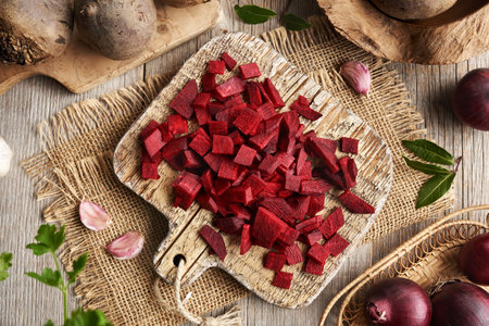 Sliced red beetroot with garlic, bay leaf, onion and allspice - preparation of homemade fermented beet kvassの写真素材