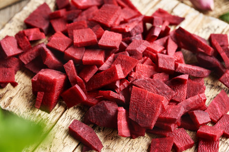 Sliced beetroot on a wooden cutting board - preparation of fermented kvassの写真素材