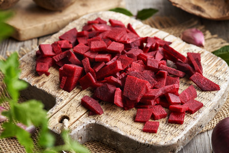 Sliced red beet on a wooden cutting board - preparation of fermented kvassの写真素材