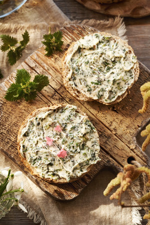 Nettle butter on slices of bread in springの写真素材