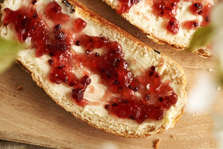 Closeup of a slice of traditional Czech sweet Easter cake called mazanec with butter and red currant marmaladeの写真素材