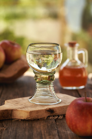 A glass of water with apple cider vinegar on a tableの写真素材