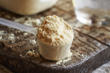 A scoop of whey protein powder on a table - healthy nutritional supplementの写真素材