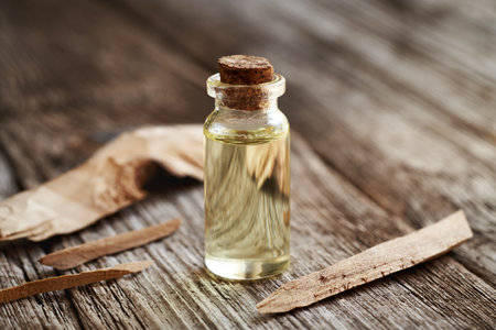 A bottle of aromatherapy essential oil with white sandalwoodの写真素材