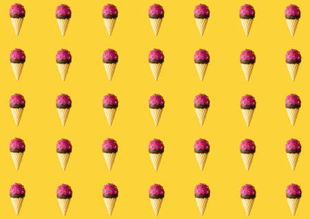 Summer pattern made with ice cream on yellow background. Flat lay.