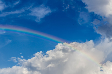 Nature cloudscape with blue sky and white cloud with rainbowの写真素材