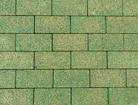 Beautiful green colorful wall of bricks (color abstact wallpaper backgrounds)の写真素材