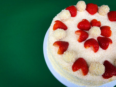 Valentines Day Anniversary Marriage Wedding Cake Raffaello with heart shaped strawberries desiccated flan coconutの写真素材