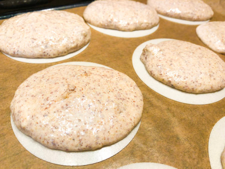 Making german almond macarons macaroon raw before baking oblate rice paper icing frosting sheetの写真素材