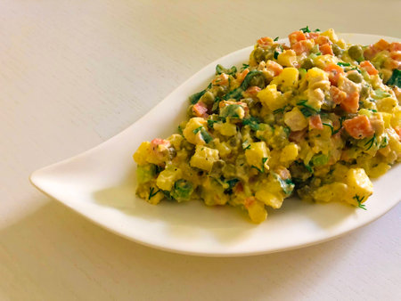 Russian traditional salad Olivier with vegetables and meat. Winter saladの写真素材