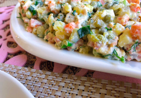 Russian traditional salad Olivier with vegetables and meat. Winter saladの写真素材