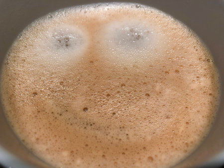 Morning Coffee cappuccino latte with foam or chocolate smiling welcome happy face have a nice dayの写真素材