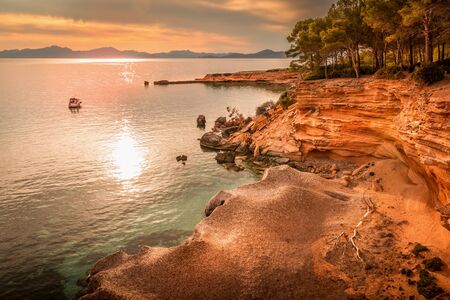 Betlem, near Colonia De Sant Pere. Cove, inlet, with old stone pier in distance. Boat or yacht...