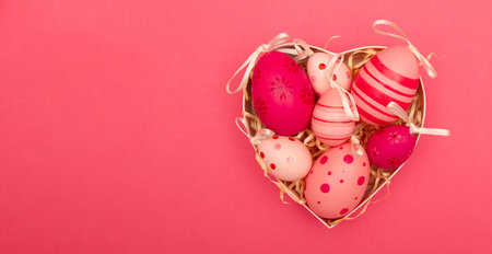 Pink banner with Easter eggs in the heart shaped box