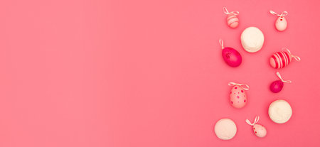 Pink Easter background offers copy space along with Easter eggs and big marshmallowsの写真素材