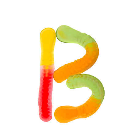 Letter B made of multicolored gummi worms and isolated on pure white background. Food alphabet concept. One letter of the set of sweet food font easy to stackingの写真素材