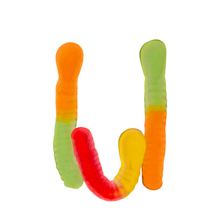 Letter U made of multicolored gummi worms and isolated on pure white background. Food alphabet concept. One letter of the set of sweet food font easy to stackingの写真素材