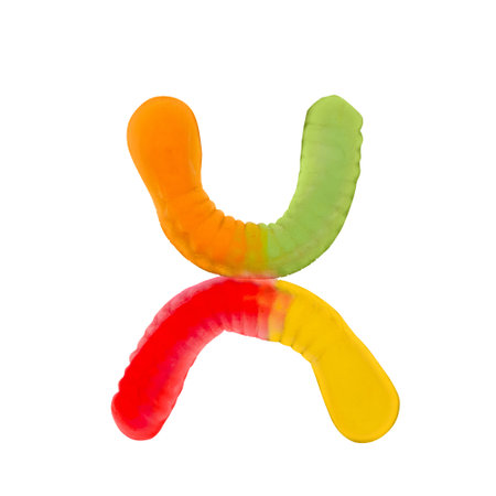 Letter X made of multicolored gummi worms and isolated on pure white background. Food alphabet concept. One letter of the set of sweet food font easy to stackingの写真素材
