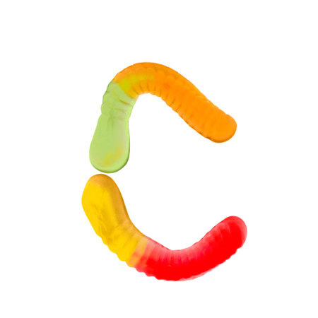 Letter C made of multicolored gummi worms and isolated on pure white background. Food alphabet concept. One letter of the set of sweet food font easy to stackingの写真素材