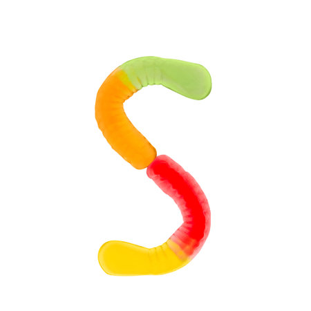 Letter S made of multicolored gummi worms and isolated on pure white background. Food alphabet concept. One letter of the set of sweet food font easy to stackingの写真素材