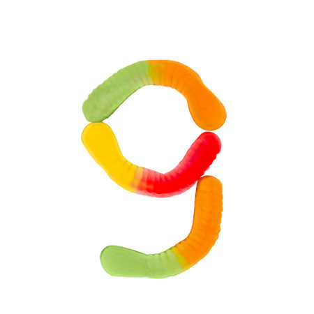 Number 9 made of gummi worms isolated on pure white background. Food numeral concept. One number of the set of sweet food font easy to stackingの写真素材