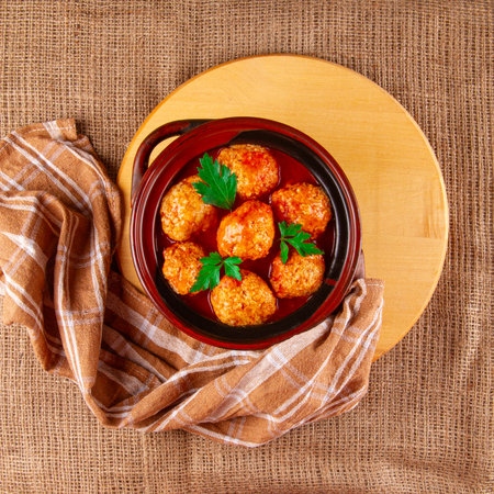 Homemade meatballs with tomato sauce and herbs served rustic styleの写真素材