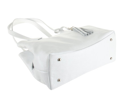 Bottom side of white women bag with four silver rivets isolated on white backgroundの写真素材