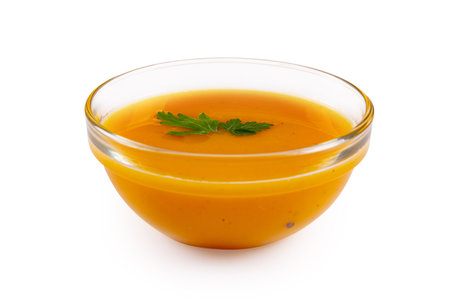 Pumpkin cream soup isolated on white backgroundの写真素材