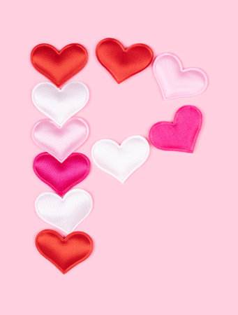 Letter P made of glossy atlas hearts isolated on solid pink background. Love alphabet concept. One letter of the set of heart's font easy to stacking.の写真素材