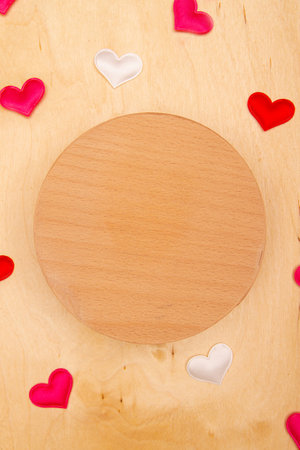 A lot of small hearts on wooden background with copy space. Rustic-inspired greeting card with love symbols.の写真素材