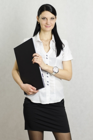 Business girl with a laptopの写真素材