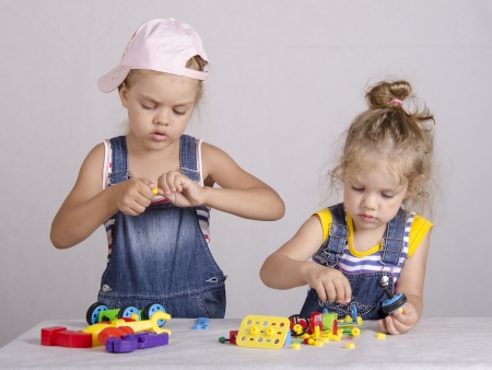 Two children play in the constructorの写真素材