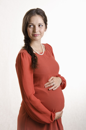 Portrait of pregnant girls looking rightの写真素材
