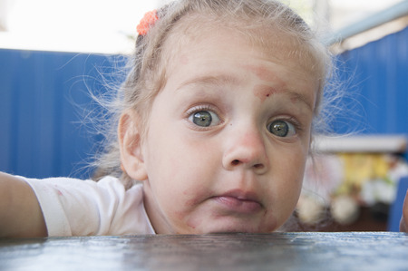 The girl ate berries astonishment looked at the picture  portrait